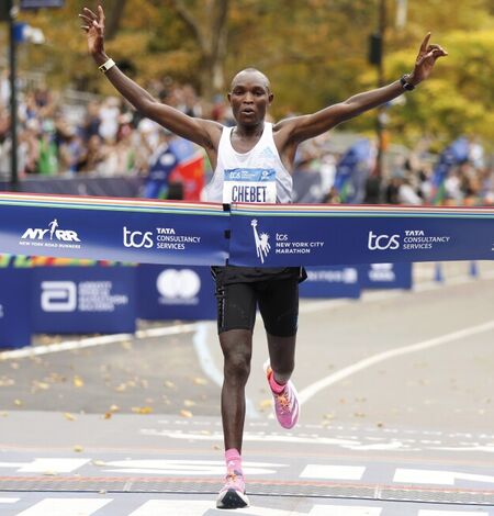 Man crossing the finish line at the New York City Marathon